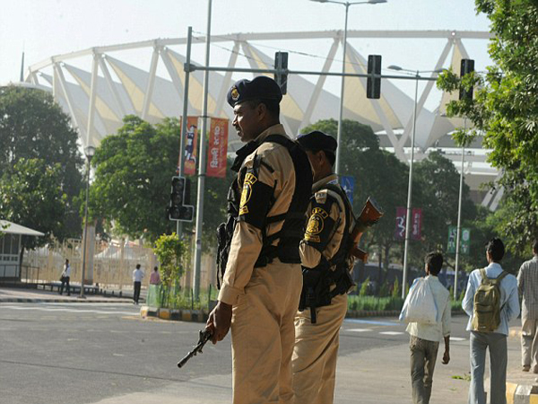 Indian security personnel stand guard beside the Jawaharlal Nehru Stadium, the main Commonwealth Games venue, following a traffic diversion in New Delhi on September 28, 2010.  The Indian capital is scheduled to host the Commonwealth Games on October 3-14, the biggest sporting event in the city since the 1982 Asian Games.   AFP PHOTO/Deshakalyan CHOWDHURY (Photo credit should read DESHAKALYAN CHOWDHURY/AFP/Getty Images)