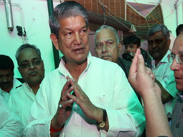 NEW DELHI, INDIA - MARCH 13: Congress leader Harish Rawat with his supporters at his residence in New Delhi on Wednesday. Rawat has been denied the post of Uttarakhand Chief Minister by party high command. (Photo by Kaushik Roy/India Today Group/Getty Images)